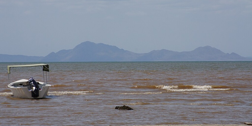 Image of the striking jade-colored waters of Lake Turkana amidst a desert landscape