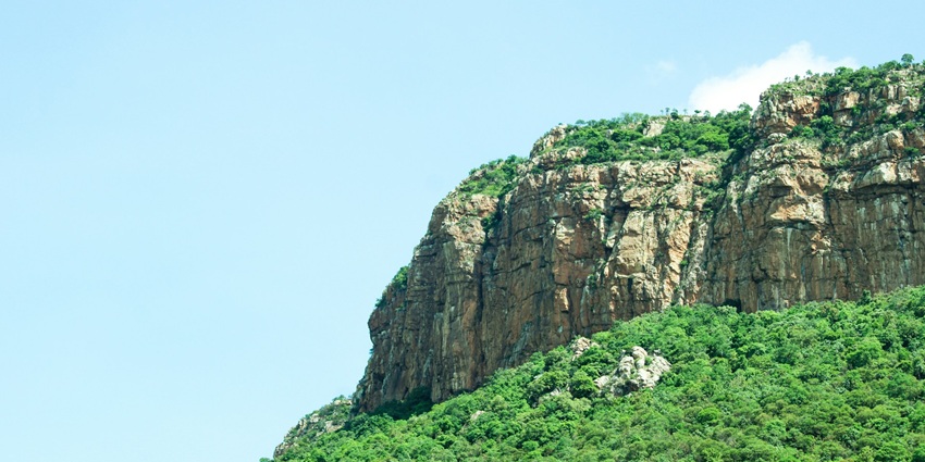 An image showing a road near Lambasinghi, surrounded by hills and natural landscapes.