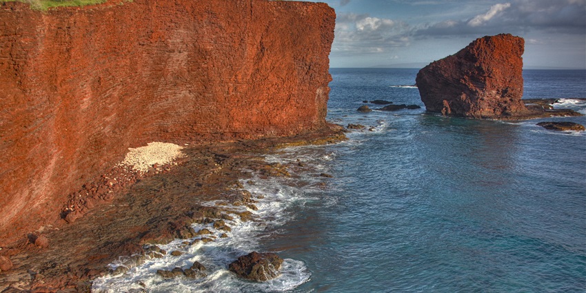 Lanai offers seclusion with luxury resorts, lush landscapes, and stunning coastlines.