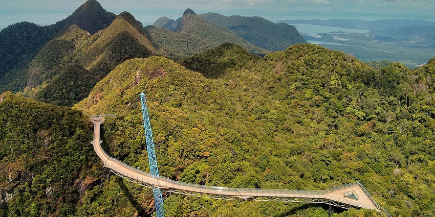 A stunning view of the Sky Bridge in Langkawi surrounded by lush green hills