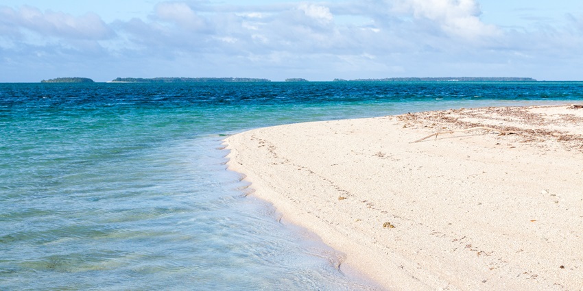 An image of the serene shores of Laura Beach, a place for the perfect coastal escape