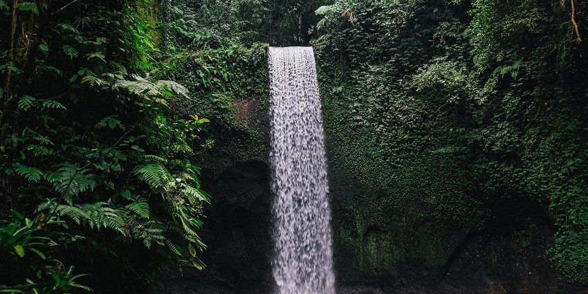 Discover a hidden paradise with cascading waters in a lush jungle setting in Indonesia.