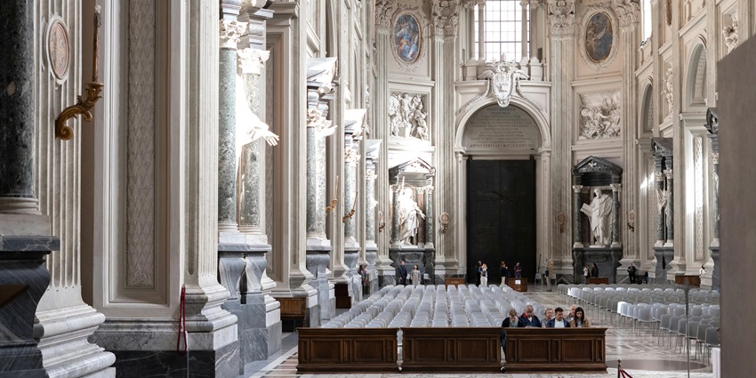 An image showing a Bible being read by a priest, symbolising faith and reflection during Lent.