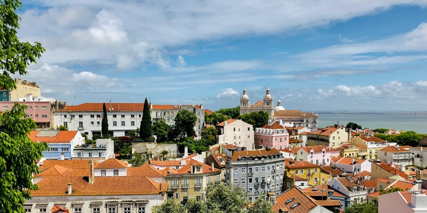 A colourful city with historic tram rides, stunning viewpoints, and delicious pastel de nata