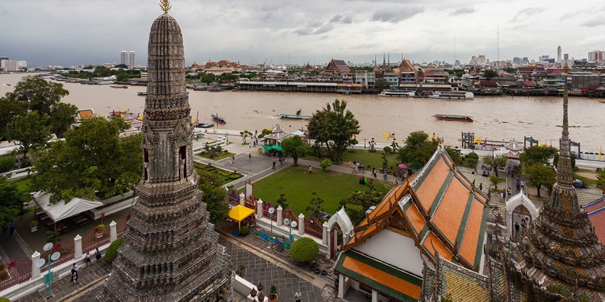 Wat Arun, a stunning riverside temple in Bangkok, offers breathtaking views at sunrise and sunset