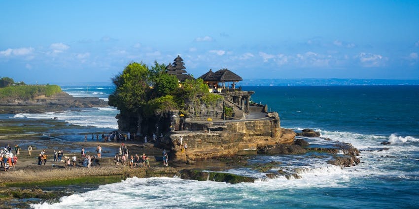 Tanah Lot Temple in Bali offers stunning ocean views on a rocky outcrop