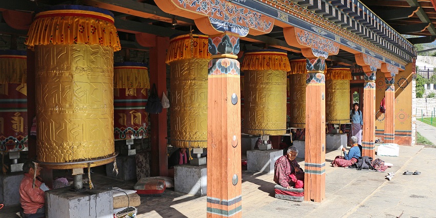 A stunning view of a golden-spired chorten standing in the heart of the chorten.