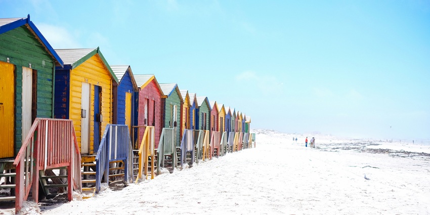 An aerial view of Muizenberg Beach Cape Town, showing its long sandy shore.