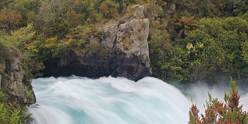 An image showing a view of Huka Falls, a popular attraction to visit in New Zealand.