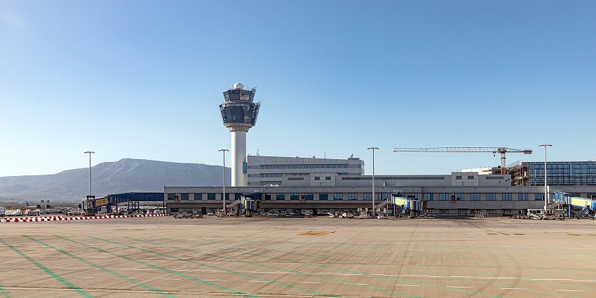 Athens International Airport terminal and control tower with construction ongoing