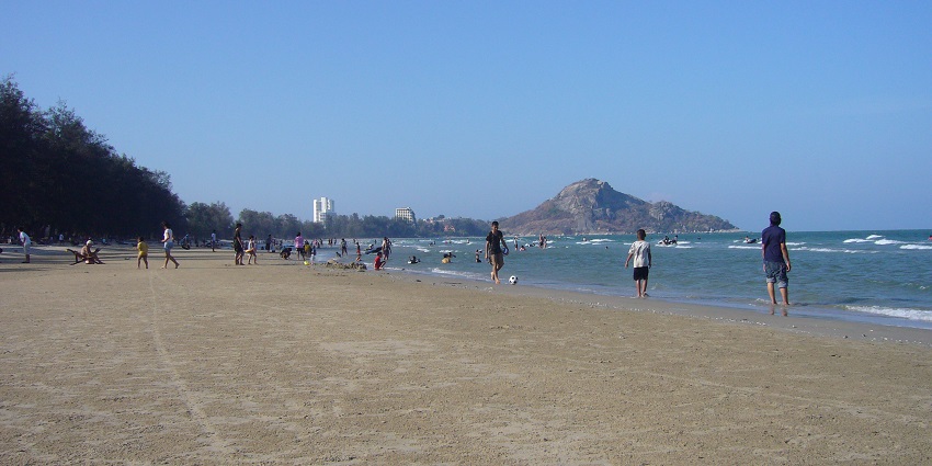 Image showing Hua Hin Beach in Thailand with a stretch of sand and people near the coast.