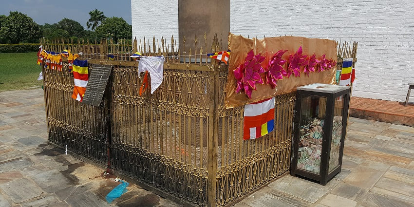 The Ashoka Pillar in Lumbini with Brahmi script at Buddha's birthplace in Nepal
