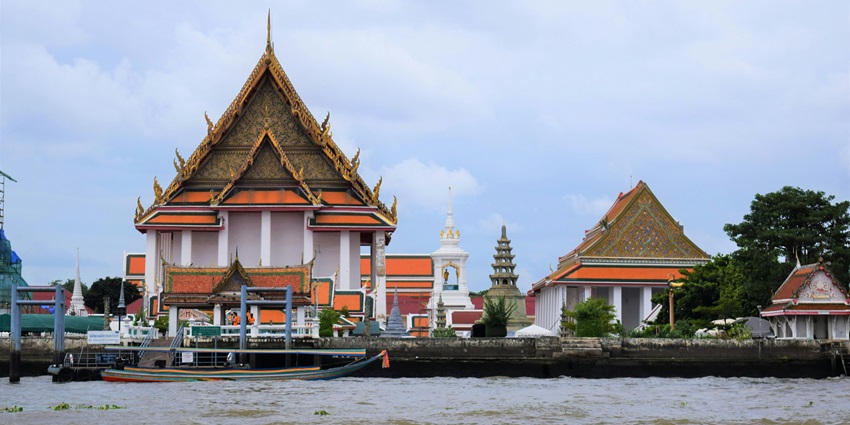 A breathtaking scene of the Chao Phraya River Cruise with the Bangkok skyline in the backdrop.