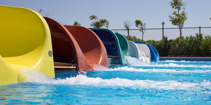 An image of multicoloured water slides in a water park similar to Shirpur water park