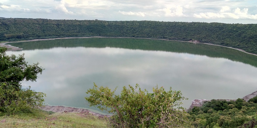 View of the Emerald green waters of Lonar Crater Lake, one of the scenic saline water lakes in the world