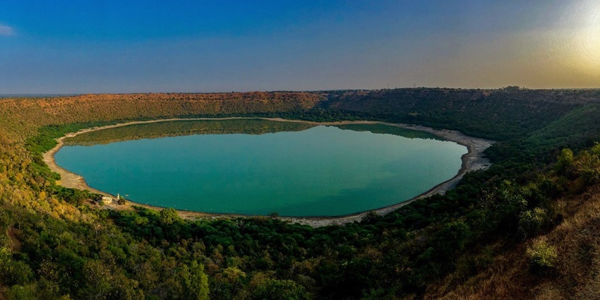 A serene view of the Lonar Lake, one of the top attractions near Shegaon Water Park.