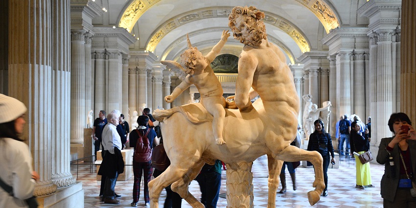 The Old Centaur sculpture at the Louvre Museum, a famous heritage museum to visit in France.