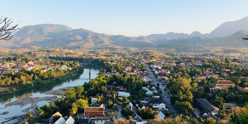 A UNESCO-listed town with golden temples, colonial charm, and Mekong River views