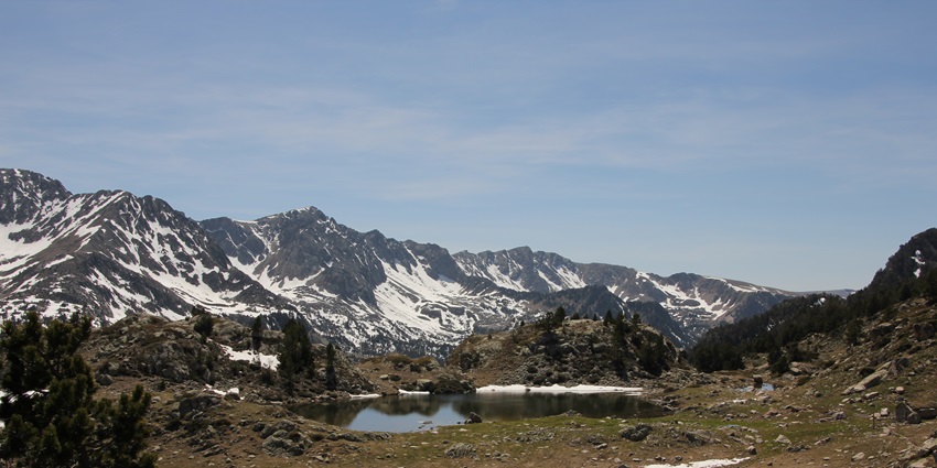A stunning landscape of Madriu-Perafita-Claror Valley with mountains and lush greenery.
