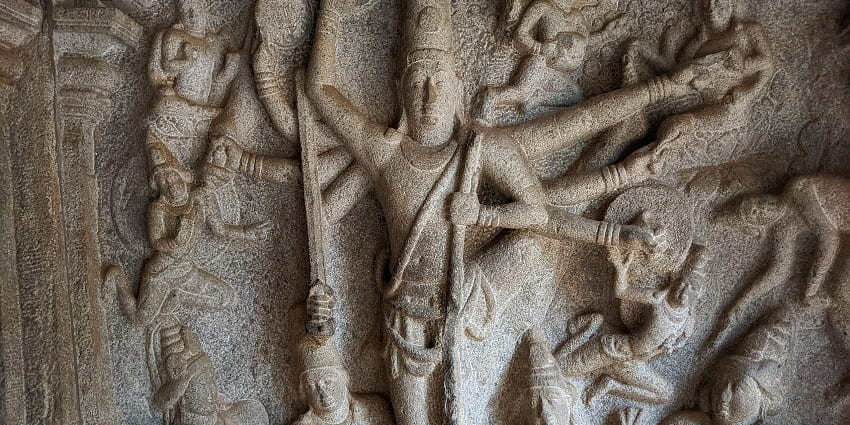 Exquisite rock cut caves at Mahabalipuram proudly exhibit ancient artistry and devotion.