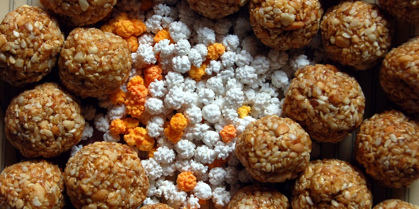 An image of traditional laddoos eaten during the festival of Makar Sankranti.