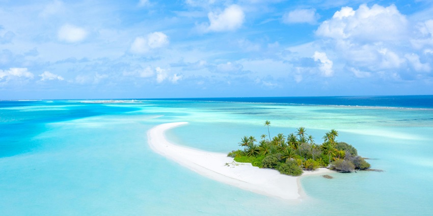 Experience ultimate luxury in the Maldives’ overwater bungalows and vibrant coral reefs.