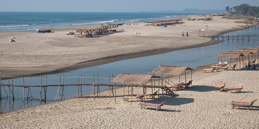 A picturesque view of Mandrem Beach featuring azure waters and sprawling coastline.
