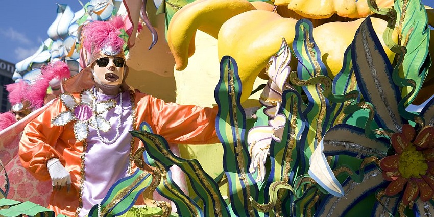A vibrant Mardi Gras parade with colorful floats and lively celebrations in full swing.