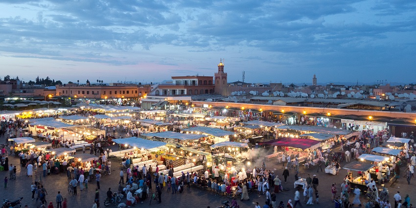 Places to visit in Africa include the historic city famous for its bustling souks, majestic palaces, and vibrant Jemaa el-Fnaa square.