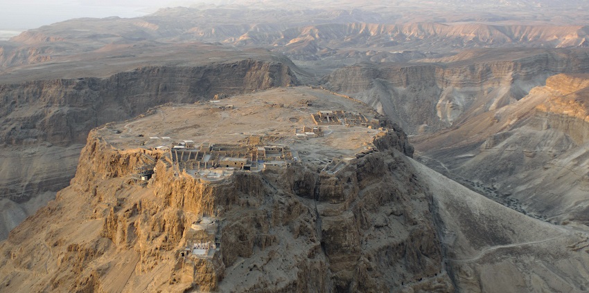 A sunrise view of Masada Fort, a famous desert site known for historical fort in Israel.