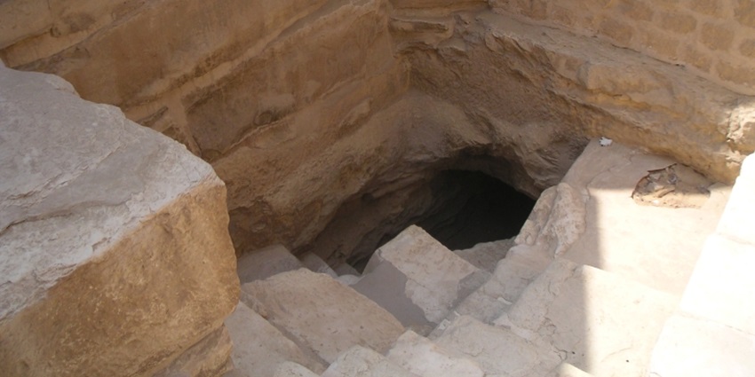 An image of the Mastaba of Ti with intricate wall carvings depicting scenes of daily life in ancient Egypt.