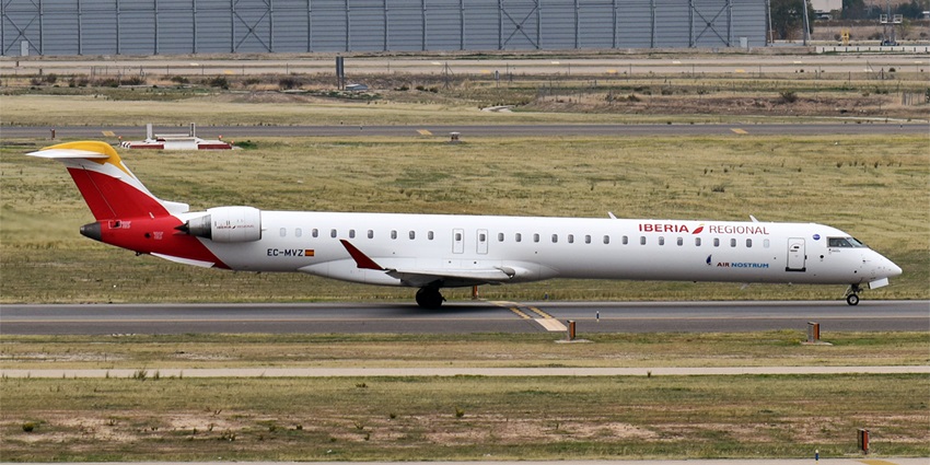 EC-MVZ aircraft parked at the airport with green grass visible around the runway