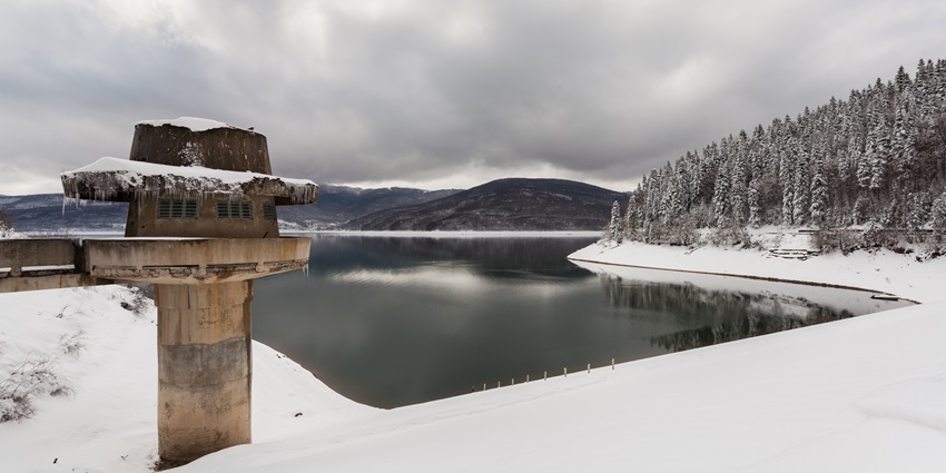 A picture of Mavrovo, a scenic place to visit in North Macedonia, with Mavrovo Lake and mountains in the background.