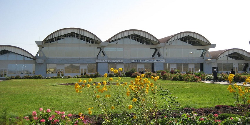 Mekelle Airport in Ethiopia with a scenic garden view in front, featuring lush greenery and flowers