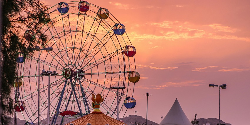 A colorful Ferris wheel in an amusement park, one of the theme parks in Mahabaleshwar.