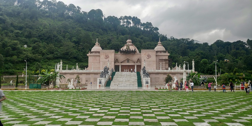Mohan Shakti Heritage Park with a traditional temple and people visiting the park