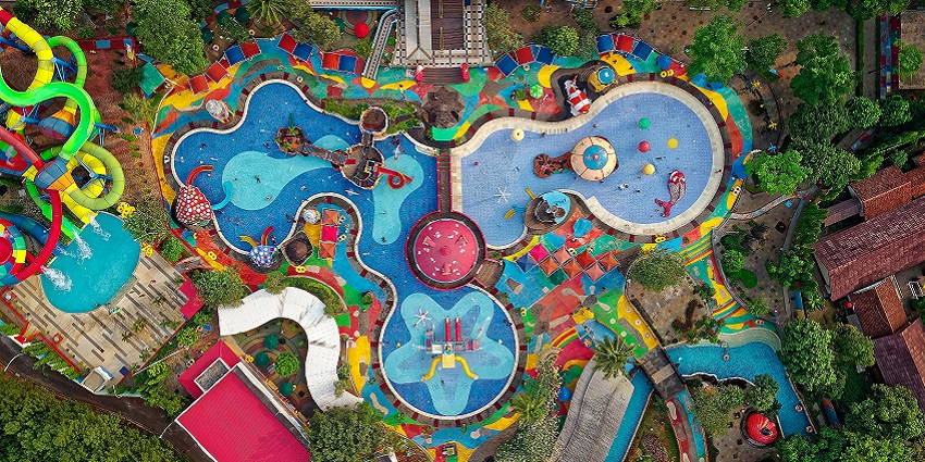 An image of Mohini Water Park in Solapur, showing its water slides, pools, and recreational areas.