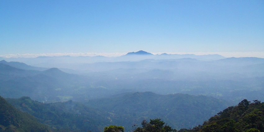 A bird’s eye view of Moon Plains featuring majestic mountains and lush greenery.