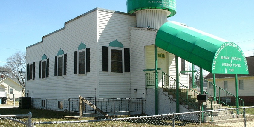 Mother Mosque Of America with white façade and historic architecture under clear blue sky.