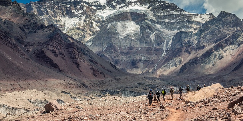 Mountaineers performing difficult mountain trekking on the rugged terrains of Aconcagua