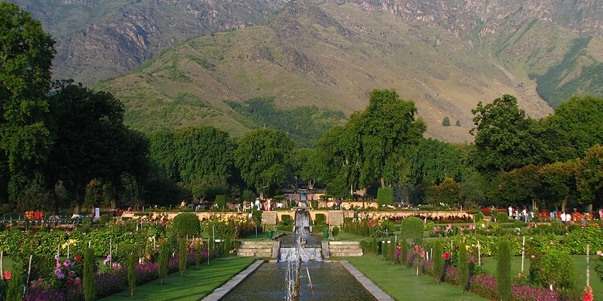 A beautifully maintained terrace garden with cascading fountains and vibrant flowers.