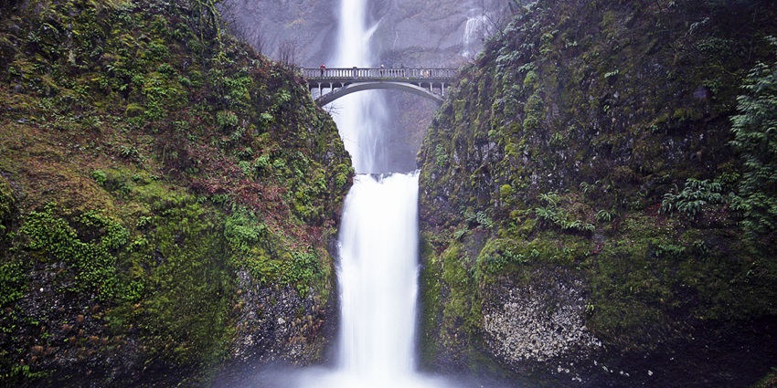 A stunning two-tiered and among the best waterfalls in America in Oregon’s Columbia River Gorge, surrounded by lush greenery.