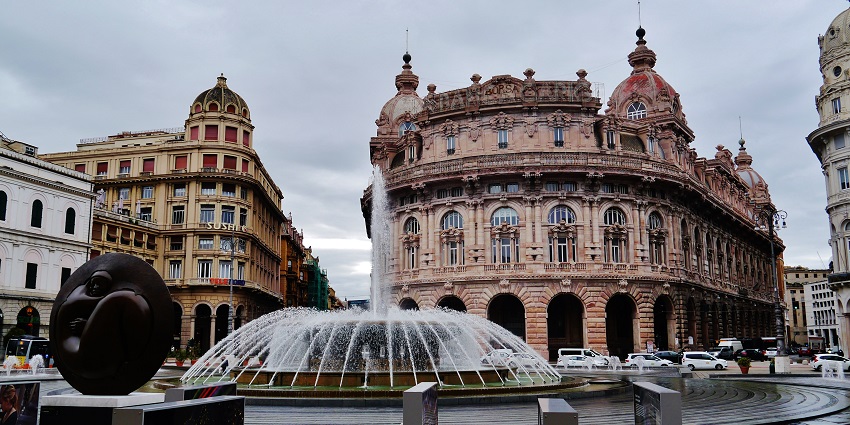 Fountain and historic buildings at Piazza De Ferrari, the main square in Genoa, Italy.