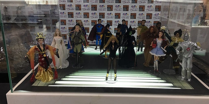 Stunning Barbie display featuring elegant dolls in designer outfits and glamorous settings