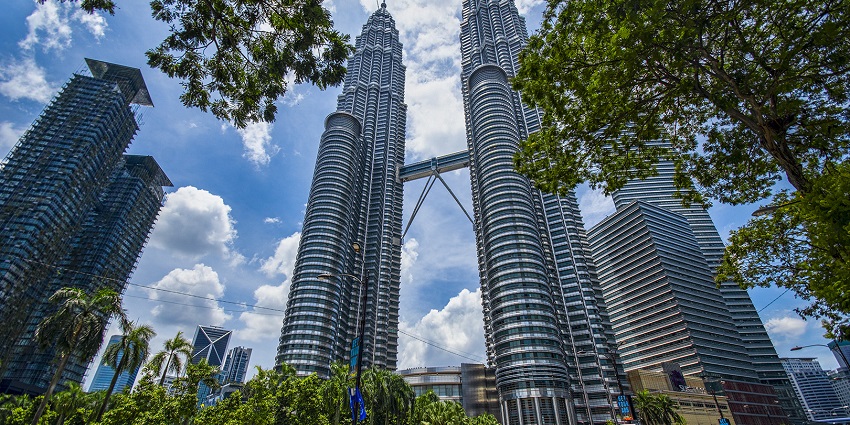 An image showing a view of the Petronas Twin Towers in Kuala Lumpur