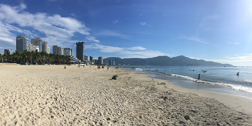 The stunning My Khe Beach in Da Nang, Vietnam, with clear blue waters and golden sand.