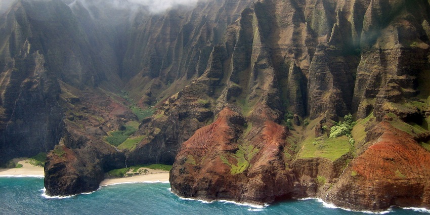 Image of the view of Nā Pali Coast, a popular destination near Hawaiian islands.