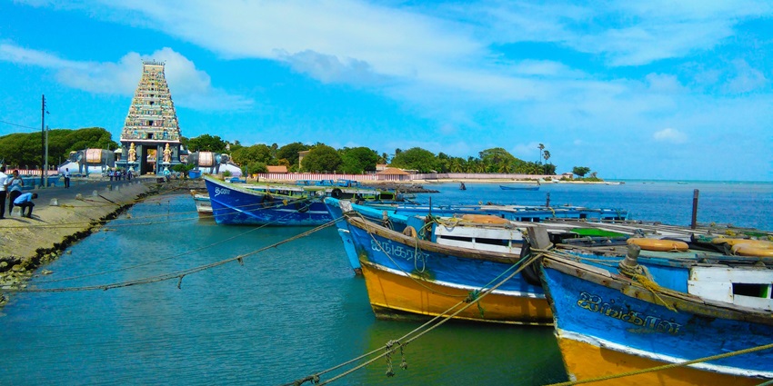 A view of Nagadeepa Island, featuring the Buddhist temple and surrounding blue waters.
