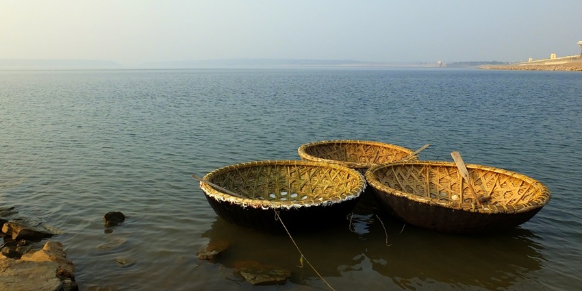 An image of Nagarjuna Lake with country boats, one of the Largest Artificial Lakes in Asia