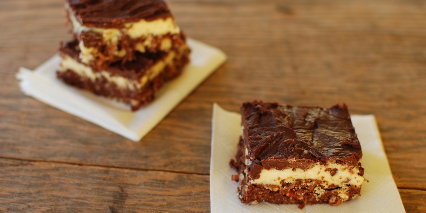 Nanaimo Bars with a creamy custard layer, chocolate topping, and crumbly base.